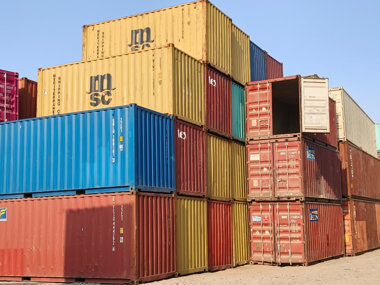 Multicoloured shipping containers stacked at the MGS yard